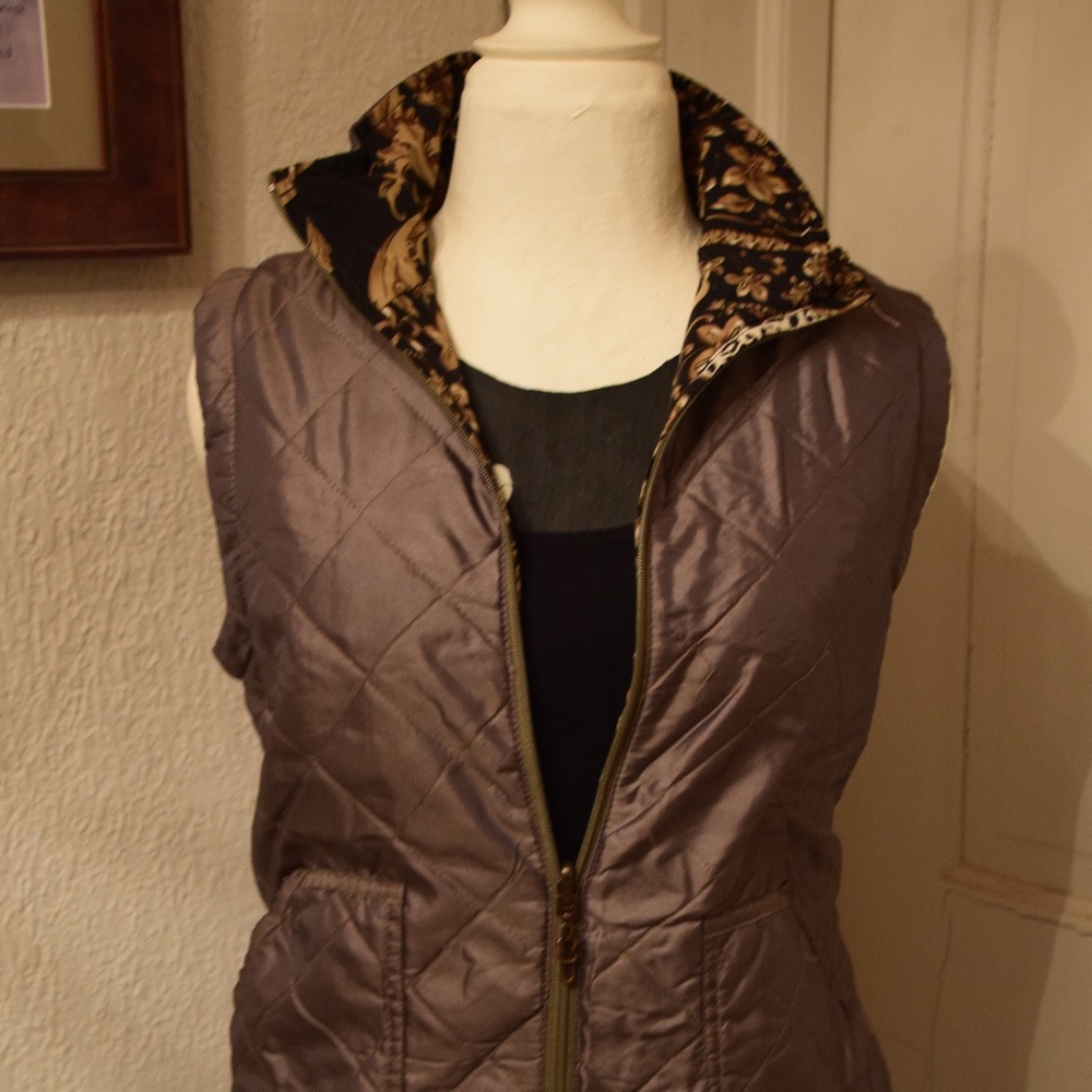 Tan vest, gold and black lined.